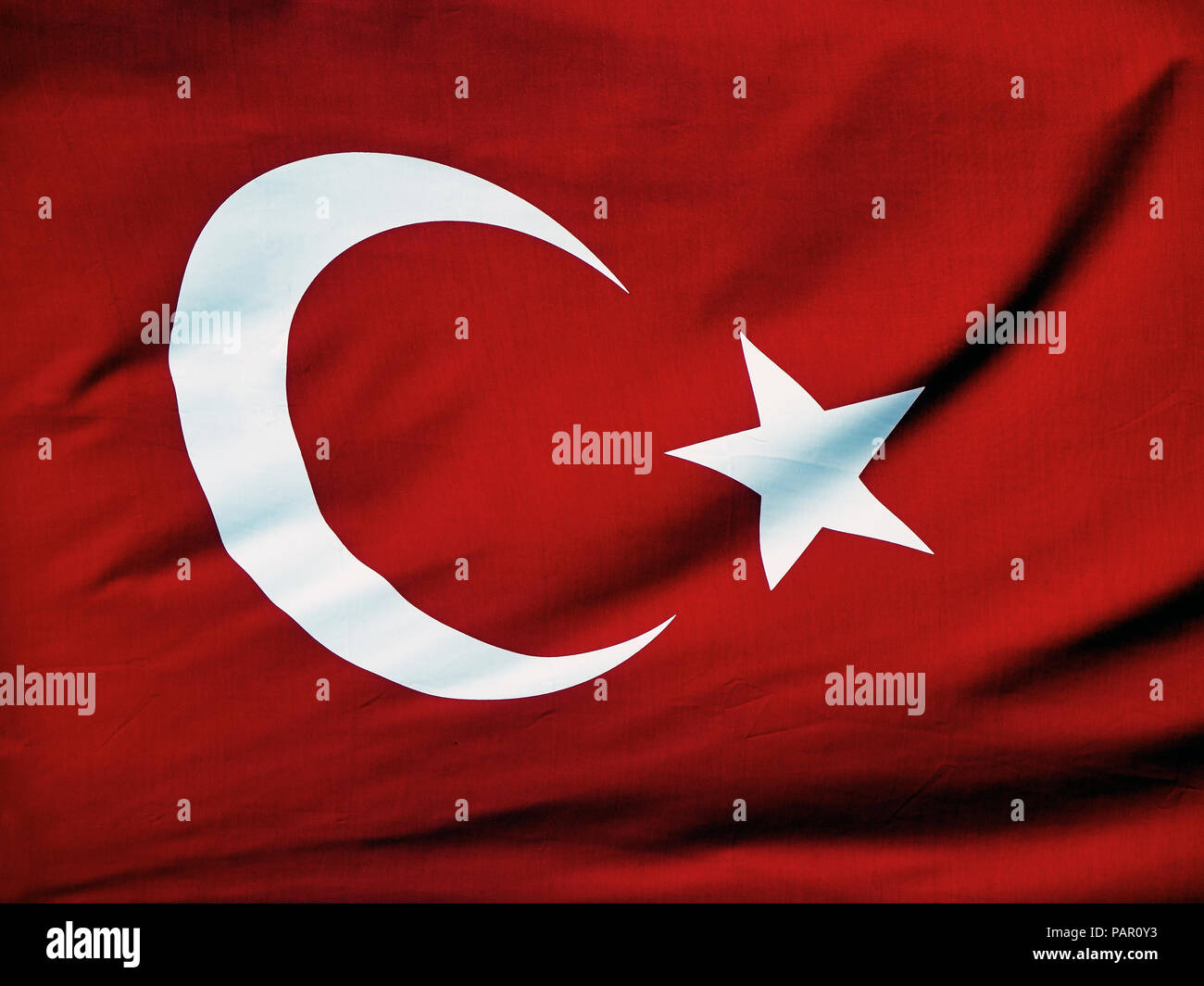 Official flag of the Republic of Turkey waving. Stock Photo