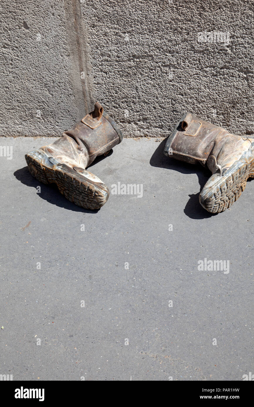 Dirty Boots on Sidewalk Stock Photo Alamy