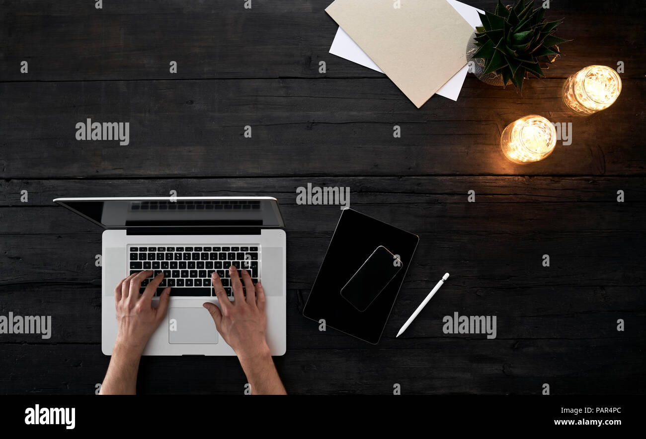 Person working in office, using laptop Stock Photo