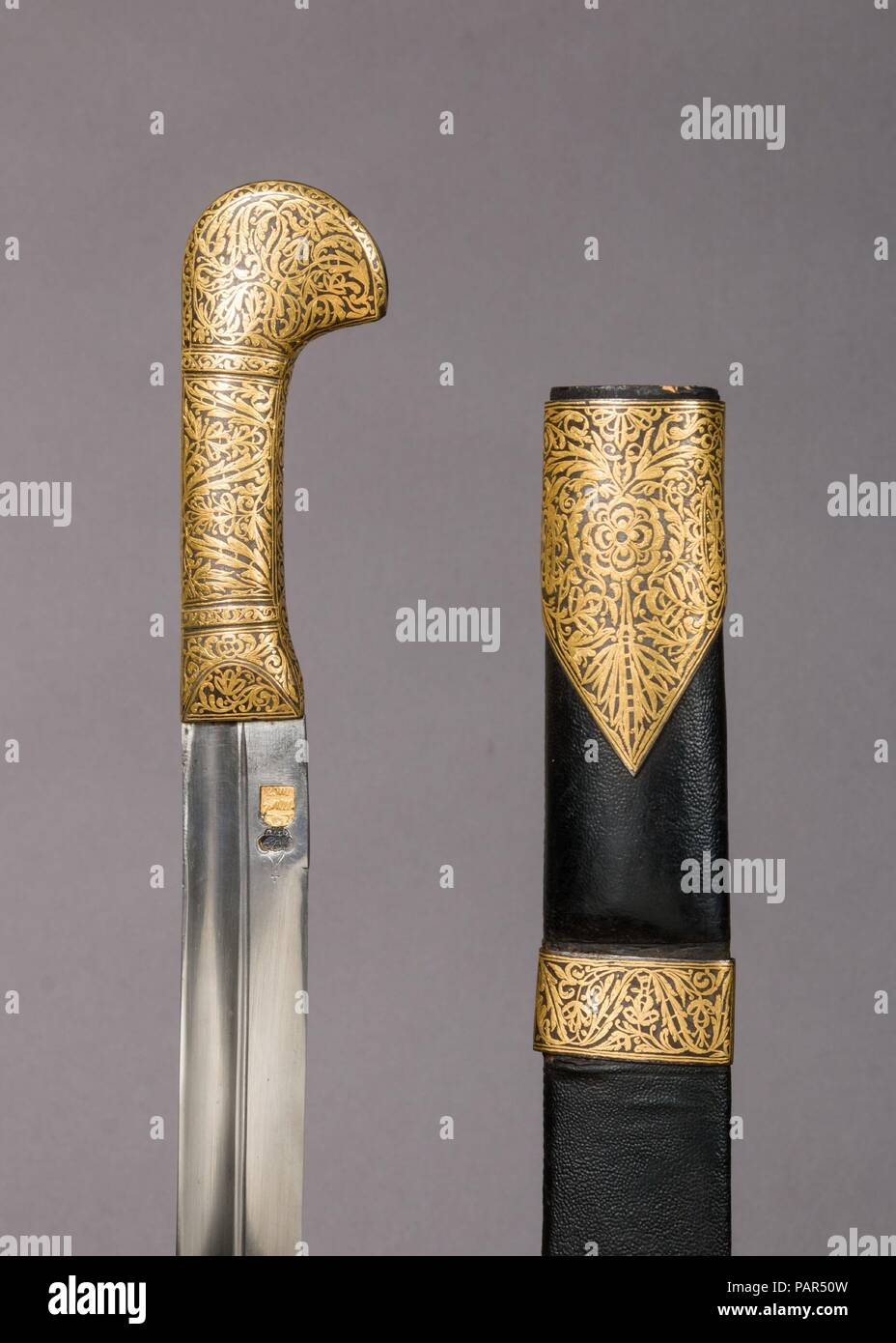 Sword with Sheath. Culture: Caucasian. Dimensions: H. with scabbard 39 7/8 in. (101.3 cm); H. without scabbard 37 5/8 in. (95.6 cm); W. 2 1/2 in. (6.4 cm); Wt. 1 lb. 10.6 oz. (754.1 g); Wt. of scabbard 7.9 oz. (224 g); Wt. of strap (c); 4.2 oz. (119.1 g). Date: 19th century. Museum: Metropolitan Museum of Art, New York, USA. Stock Photo