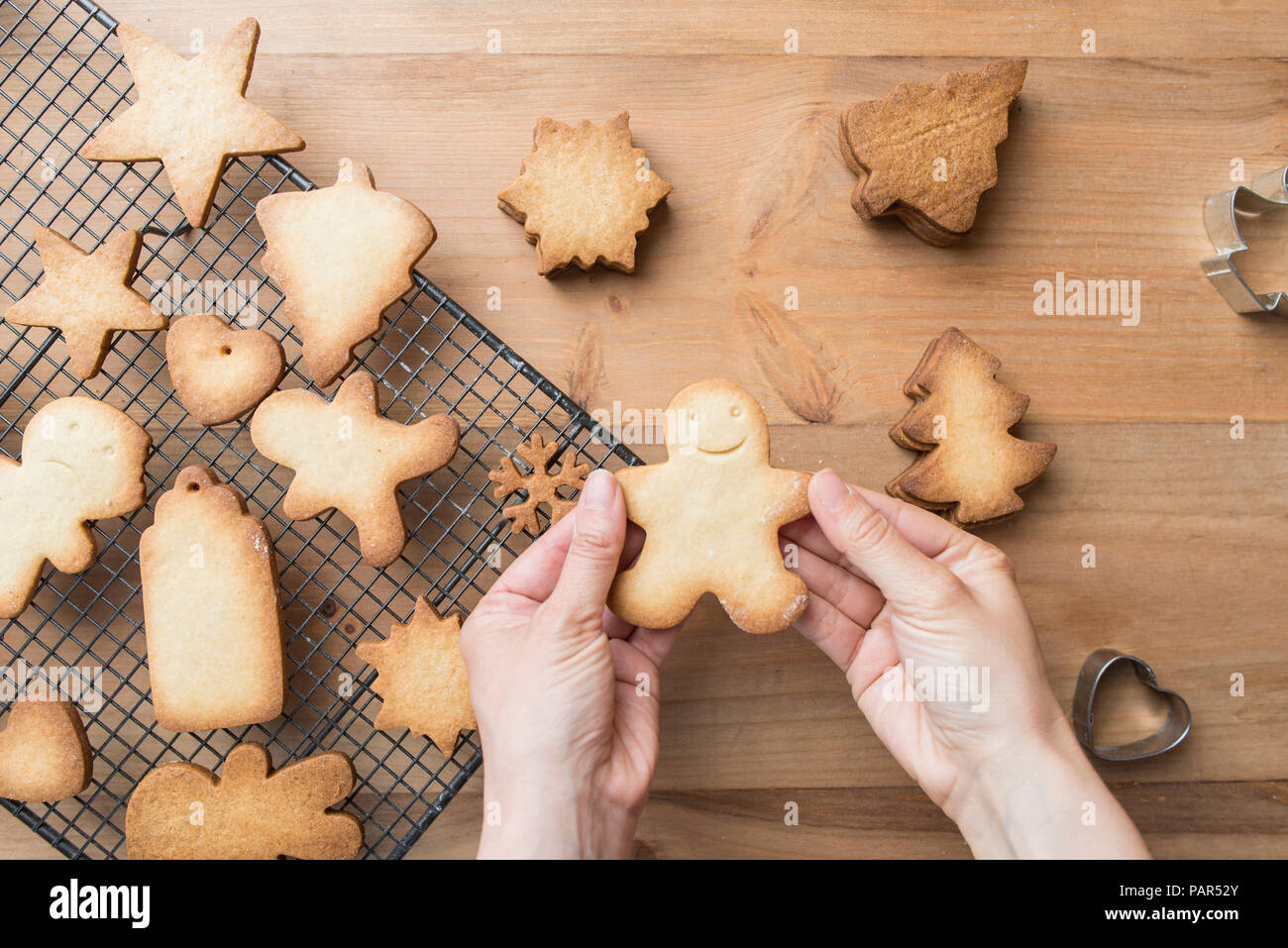 Woman's hands holding Gingerbread man Stock Photo