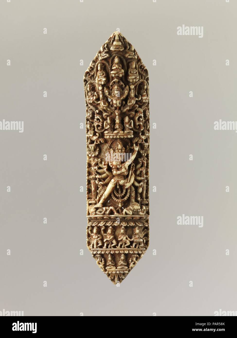 Plaque from a Tantric Ritual Apron (Chakrasamvara and Vajravarahi at Center). Culture: Nepal. Dimensions: H. 6 9/16 in. (16.7 cm). Date: 16th century or later. Museum: Metropolitan Museum of Art, New York, USA. Stock Photo