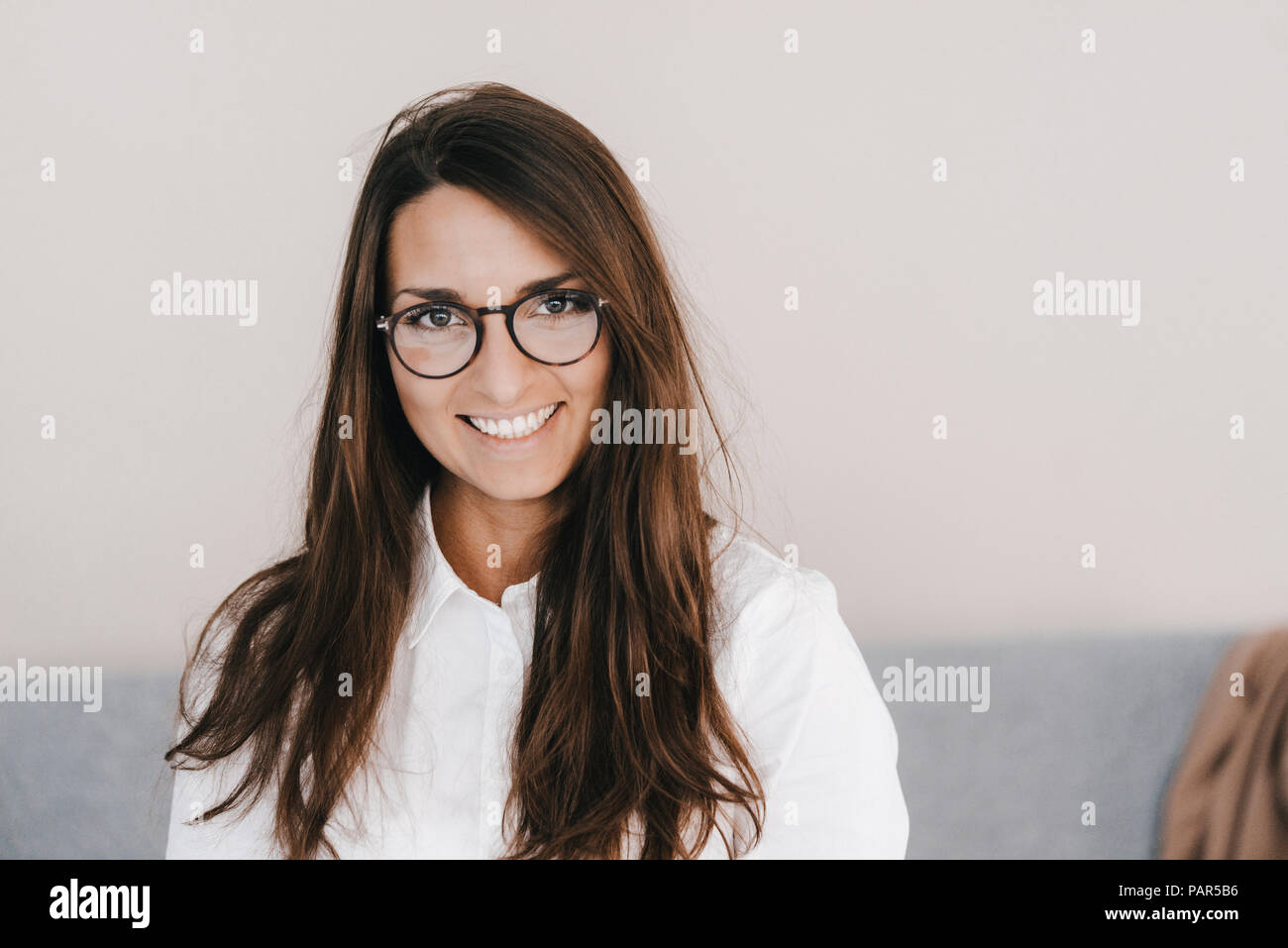 Portrait of a pretty, clever, young woman, wearing glasses Stock Photo