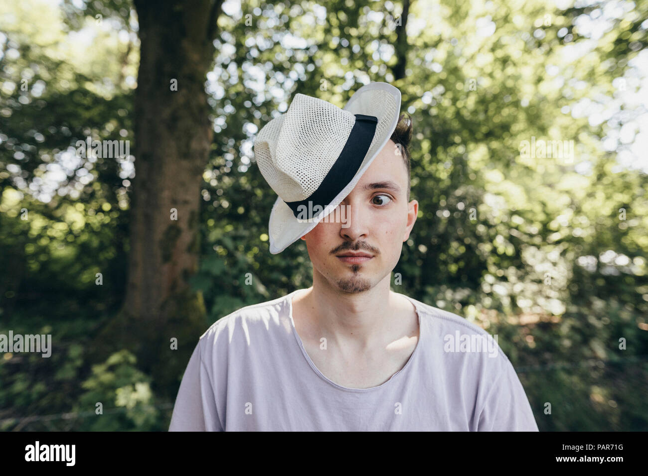 Portrait of silly young man wearing a hat Stock Photo