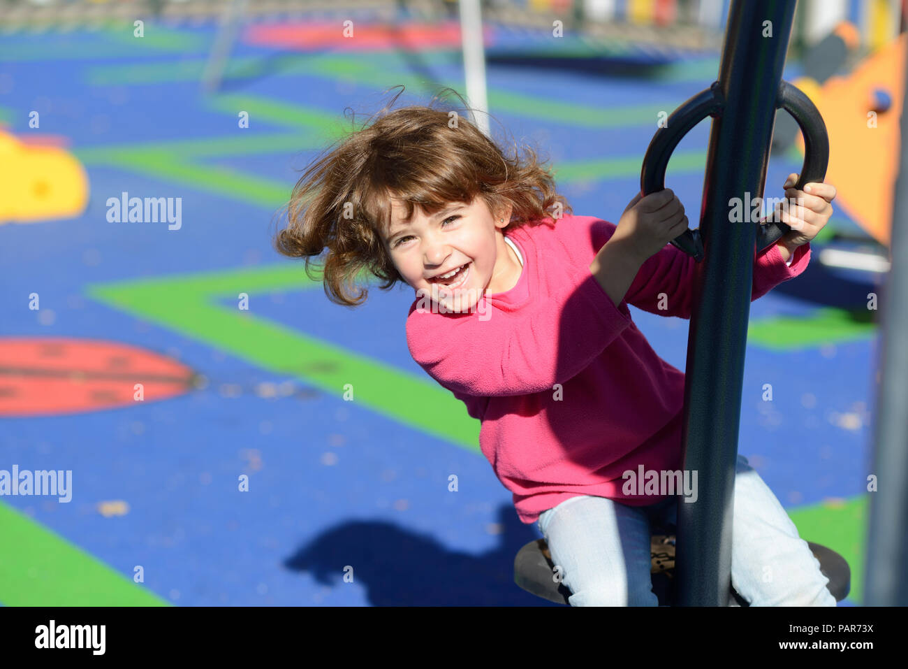 Portrait of happy little girl on playground Stock Photo - Alamy