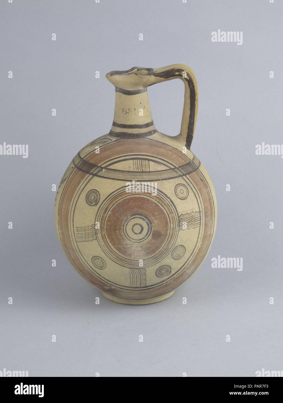 Jug. Culture: Cypriot. Dimensions: 8in. (20.3cm). Date: 600-480 B.C..  Vertical circles and lotus panel. Museum: Metropolitan Museum of Art, New York, USA. Stock Photo