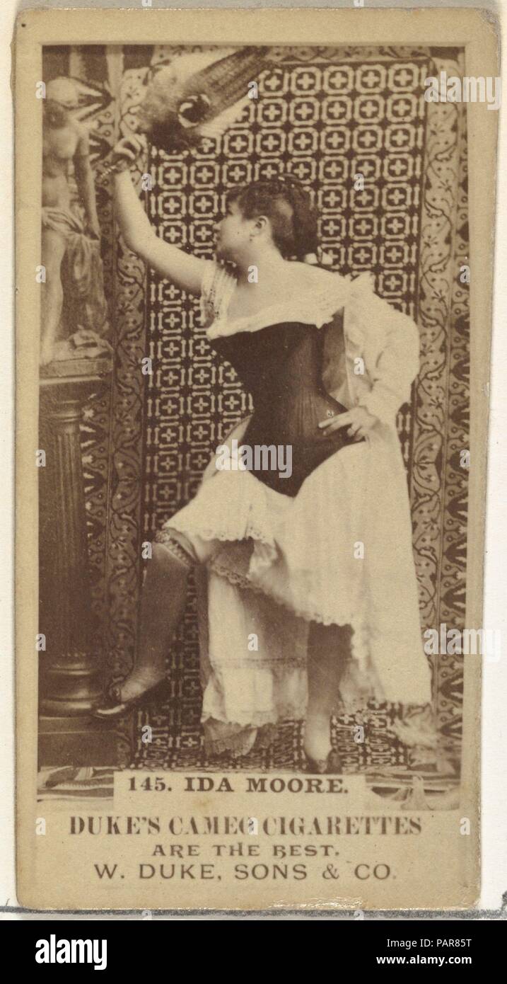 Card Number 145, Ida Moore, from the Actors and Actresses series (N145-5) issued by Duke Sons & Co. to promote Cameo Cigarettes. Dimensions: Sheet: 2 11/16 × 1 3/8 in. (6.8 × 3.5 cm). Publisher: Issued by W. Duke, Sons & Co. (New York and Durham, N.C.). Date: 1880s.  Trade cards from the set 'Actors and Actresses' (N145-5), issued in the 1880s by W. Duke Sons & Co. to promote Cameo Cigarettes. There are eight subsets of the N145 series. Various subsets sport different card designs and also promote different tobacco brands represented by W. Duke Sons & Company. This card is from the fifth subse Stock Photo