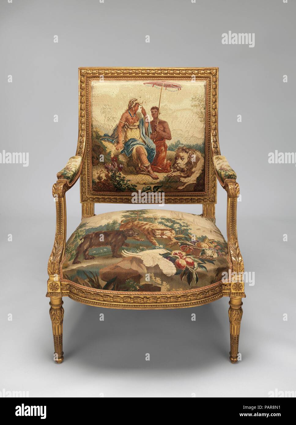 Armchair. Artist: After a composition by Jean Jacques François Le Barbier (French, Rouen 1738-1826 Paris). Culture: French, Beauvais. Dimensions: Overall: 37 3/4 × 27 × 24 in. (95.9 × 68.6 × 61 cm). Factory: Tapestry upholstery by Beauvais. Maker: Workshop of de Menou (French, active 1780-93). Patron: Commissioned for Louis XVI, King of France (French, Versailles 1754-1793 Paris). Date: designed ca. 1786, woven 1790-91; chair frame second half 19th century.  Commissioned by Louis XVI, this ensemble belongs to a set of four wall hangings (1978.404.1-.4) and fifty-six pieces of furniture upholst Stock Photo