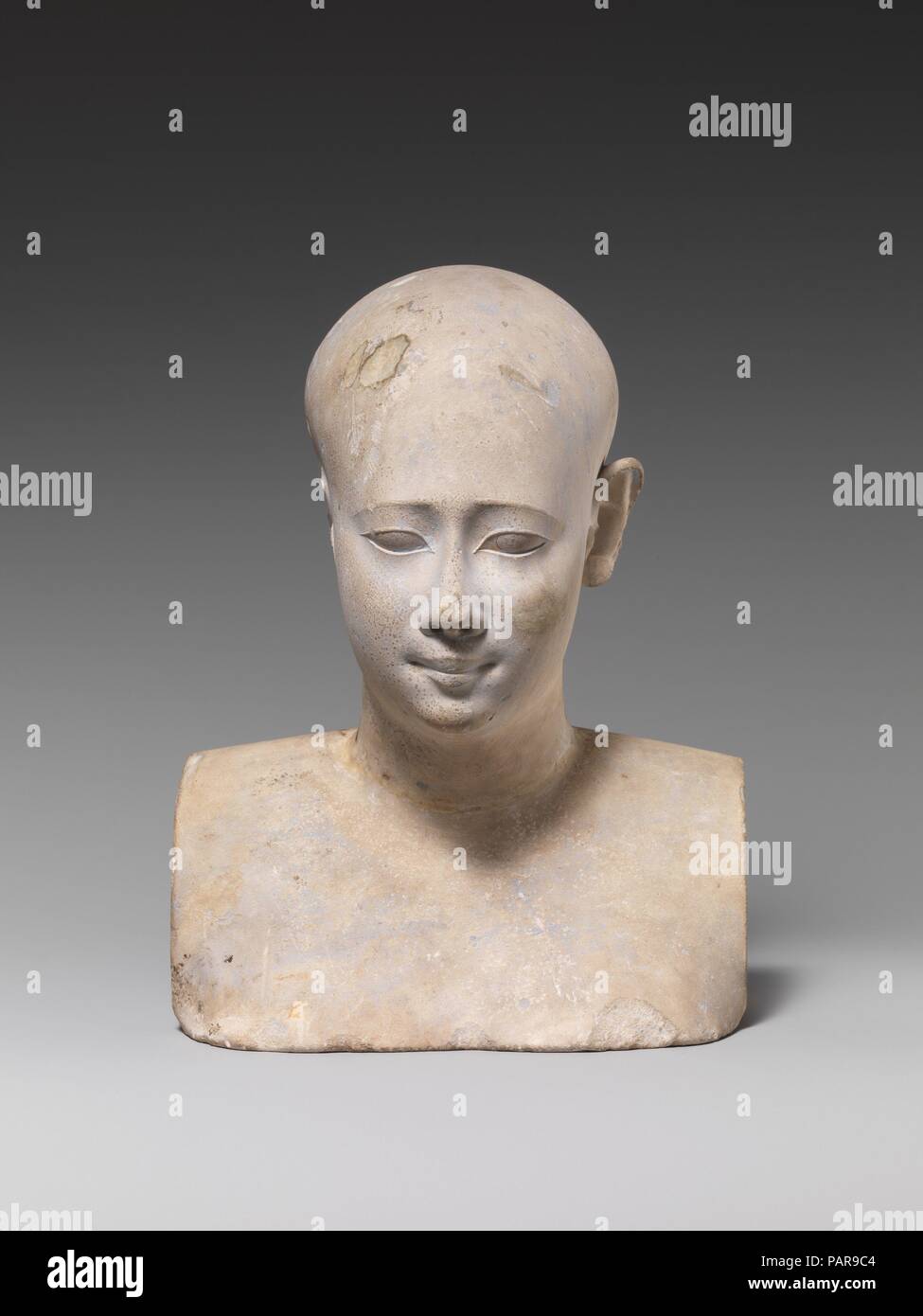 Bust of a priestly figure. Dimensions: H. 19 cm (7 1/2 in); W. 14.6 cm (5  3/4 in.); D. 12 cm (4 3/4 in.). Date: 400-200 B.C.. Small Late Period and  Ptolemaic