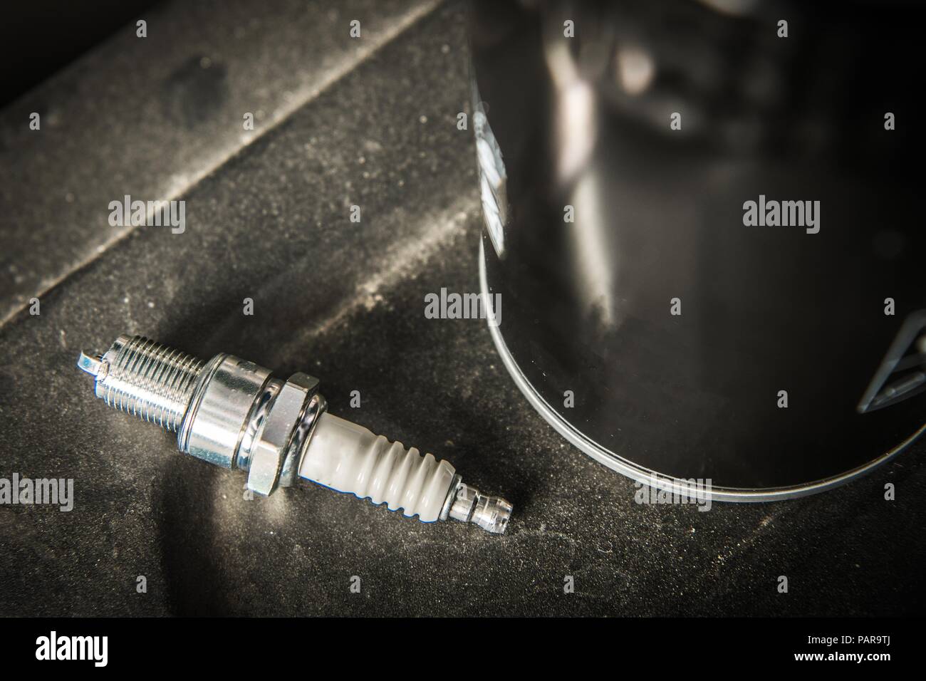 Modern vehicle spark plug and oil filter scheduled car maintenance