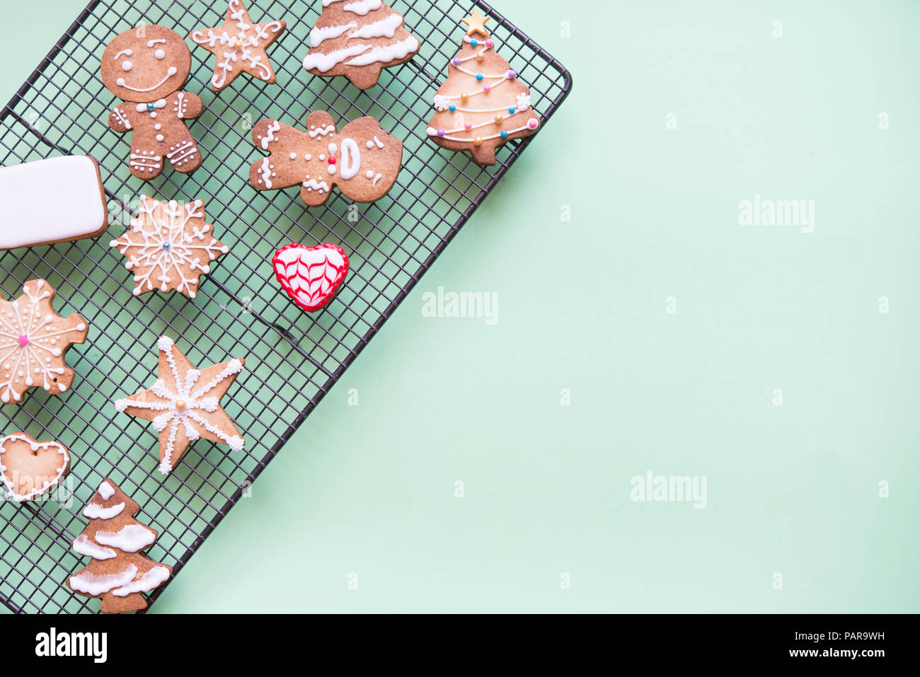 Gingerbread decorated with sugar icing on cooling rack Stock Photo
