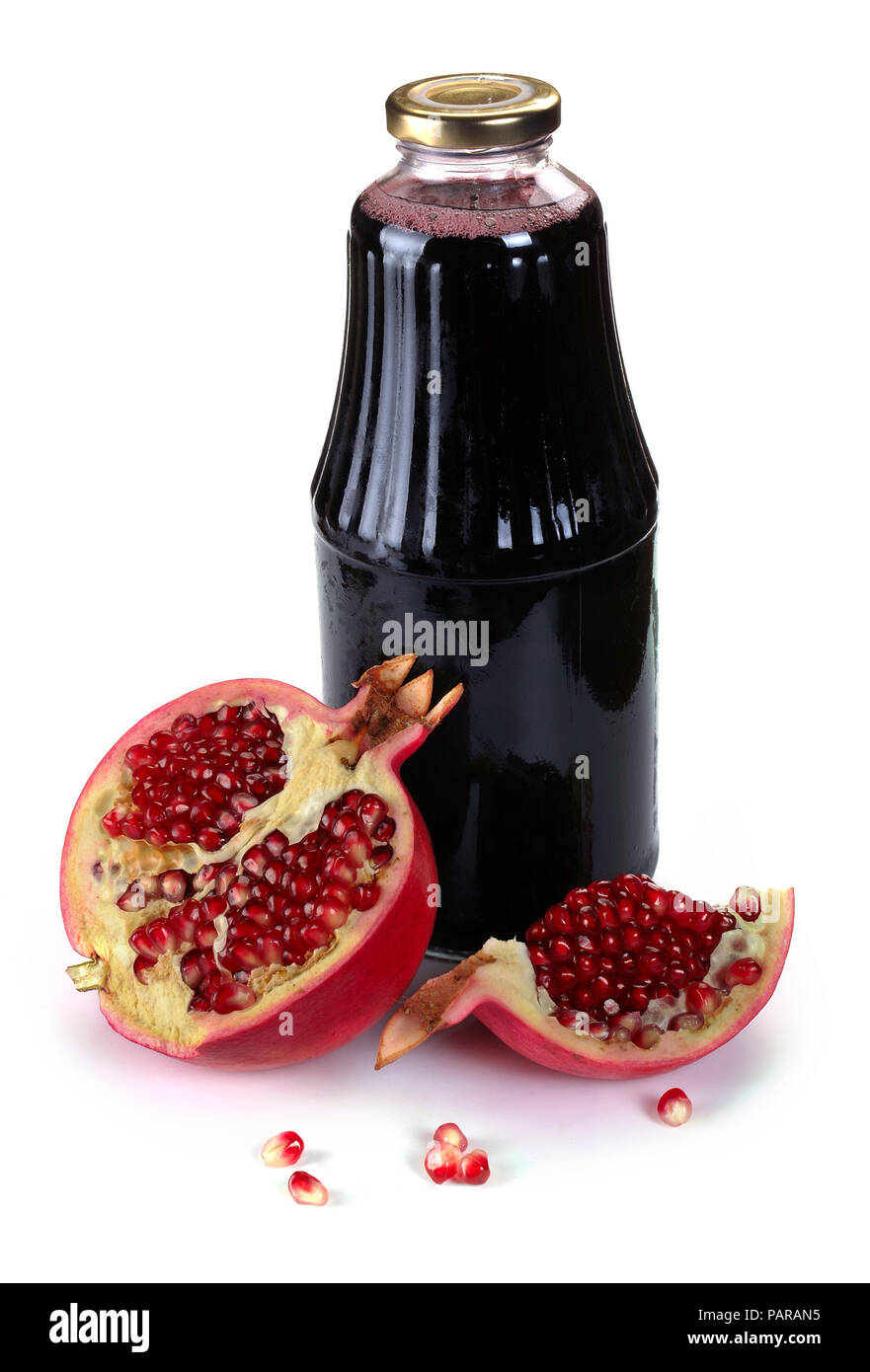 Bottle of juice and ripe piece grenade on white background Stock Photo