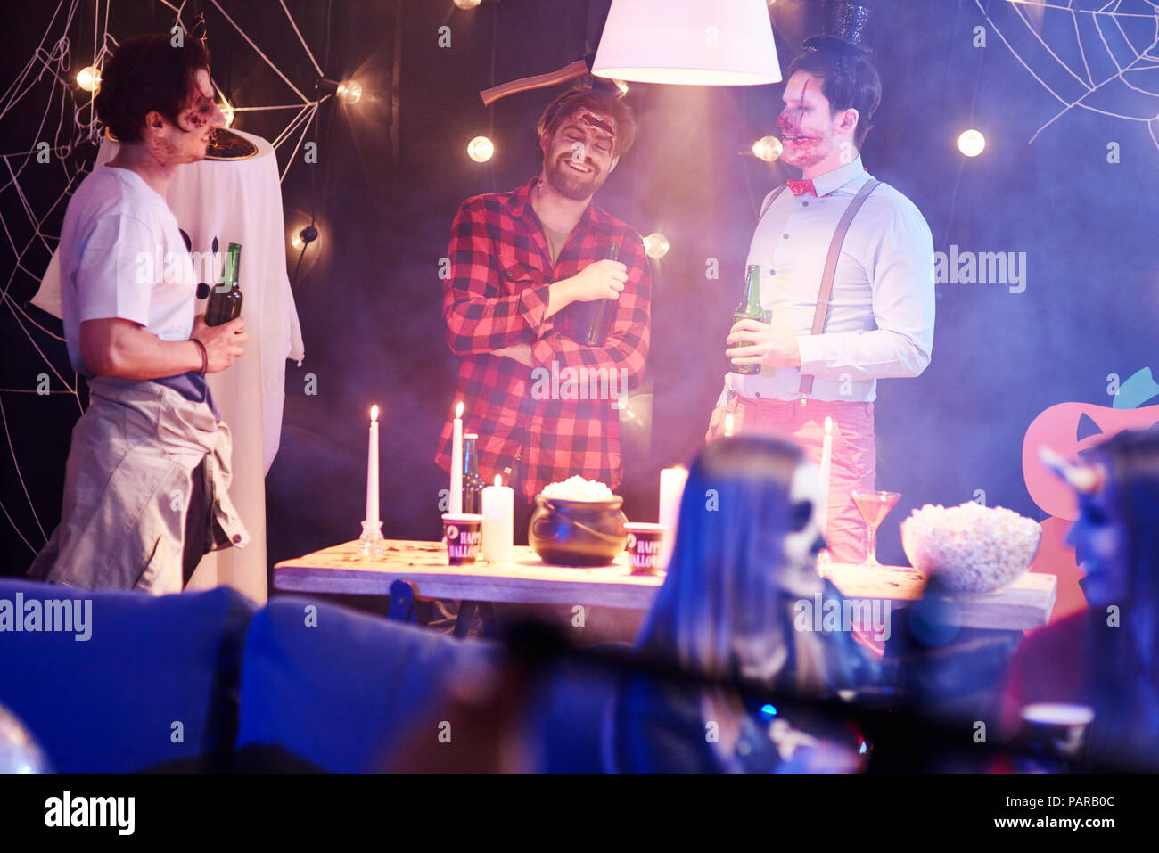 Funny disussion at Halloween party Stock Photo