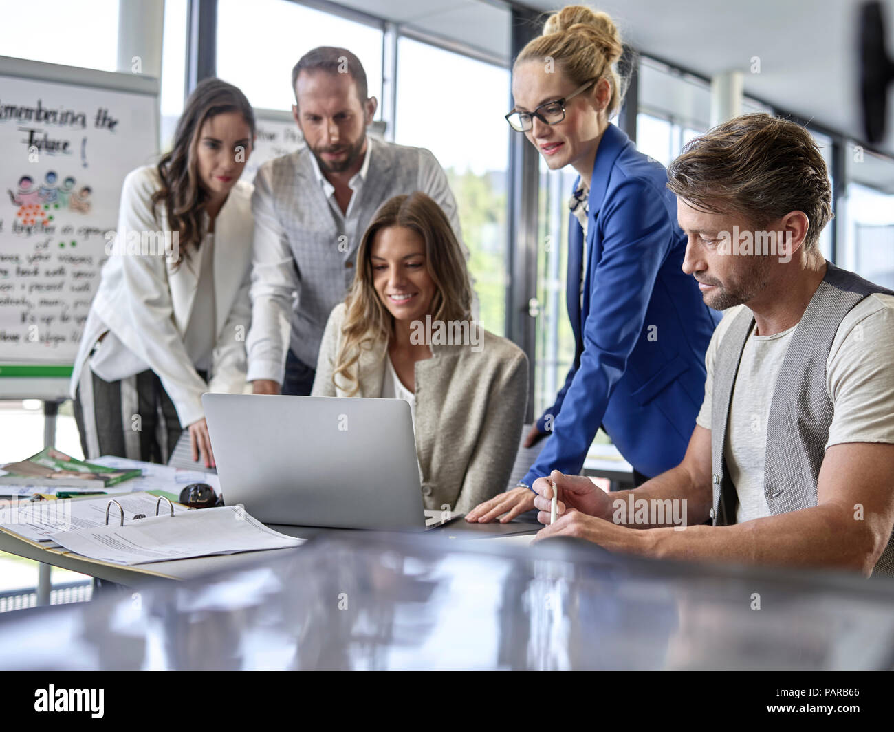 Business people having a workshop sharing laptop Stock Photo