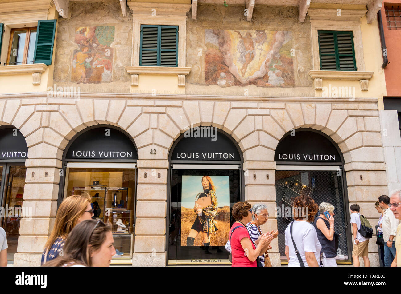 louis vuitton store shop front, Fresco on Wall, balcony, balconies, verandah, typical street, Verona, Italy Stock Photo