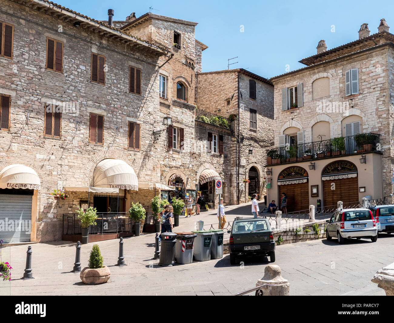 Shops in the medieval town plaza of Assisi in Italy Stock Photo - Alamy