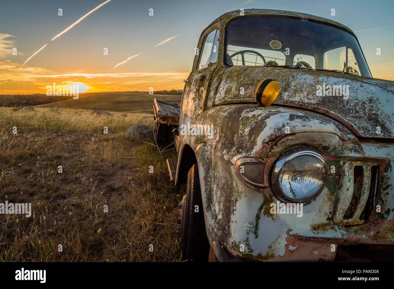 Abandoned wreck car in a field in Australia at sunset Stock Photo - Alamy