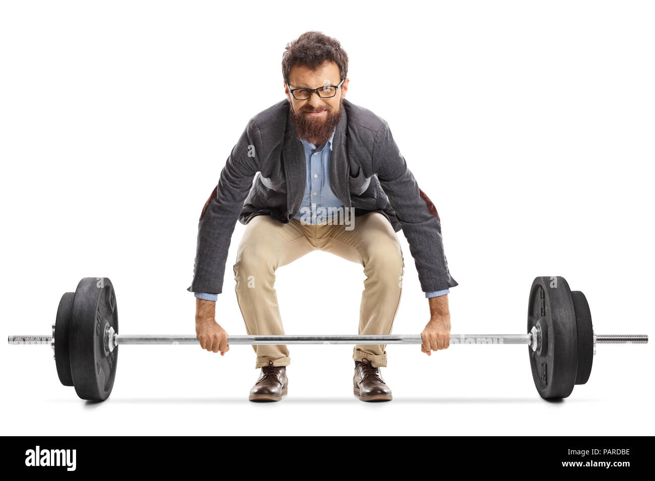 Young man struggling to lift a barbell isolated on white background Stock Photo