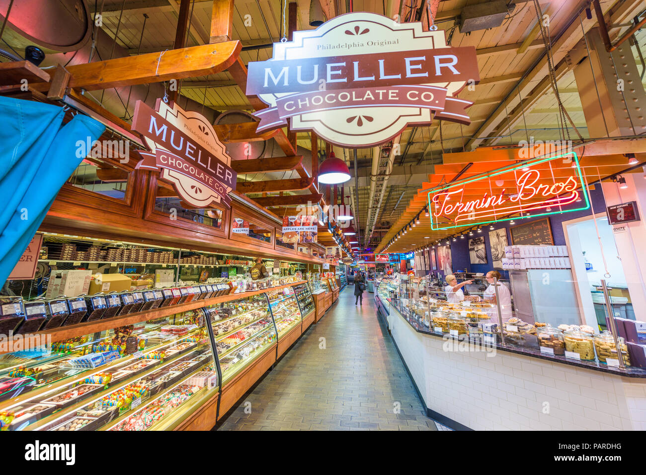 PHILADELPHIA, PENNSYLVANIA - NOVEMBER 18, 2016: Vendors and customers in Reading Terminal Market. The historic market is a popular attraction for culi Stock Photo