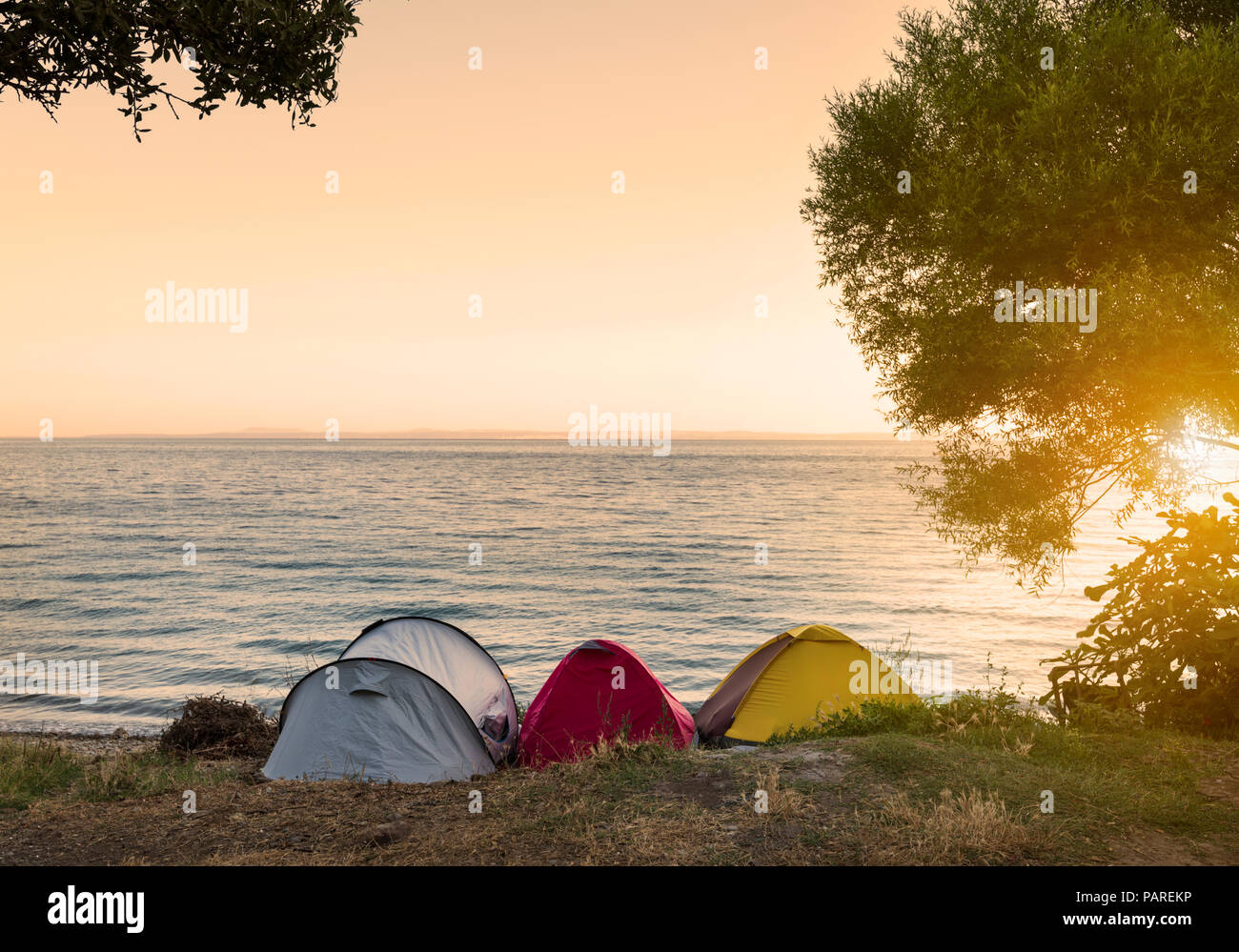 tents at the beach at sunrise Stock Photo
