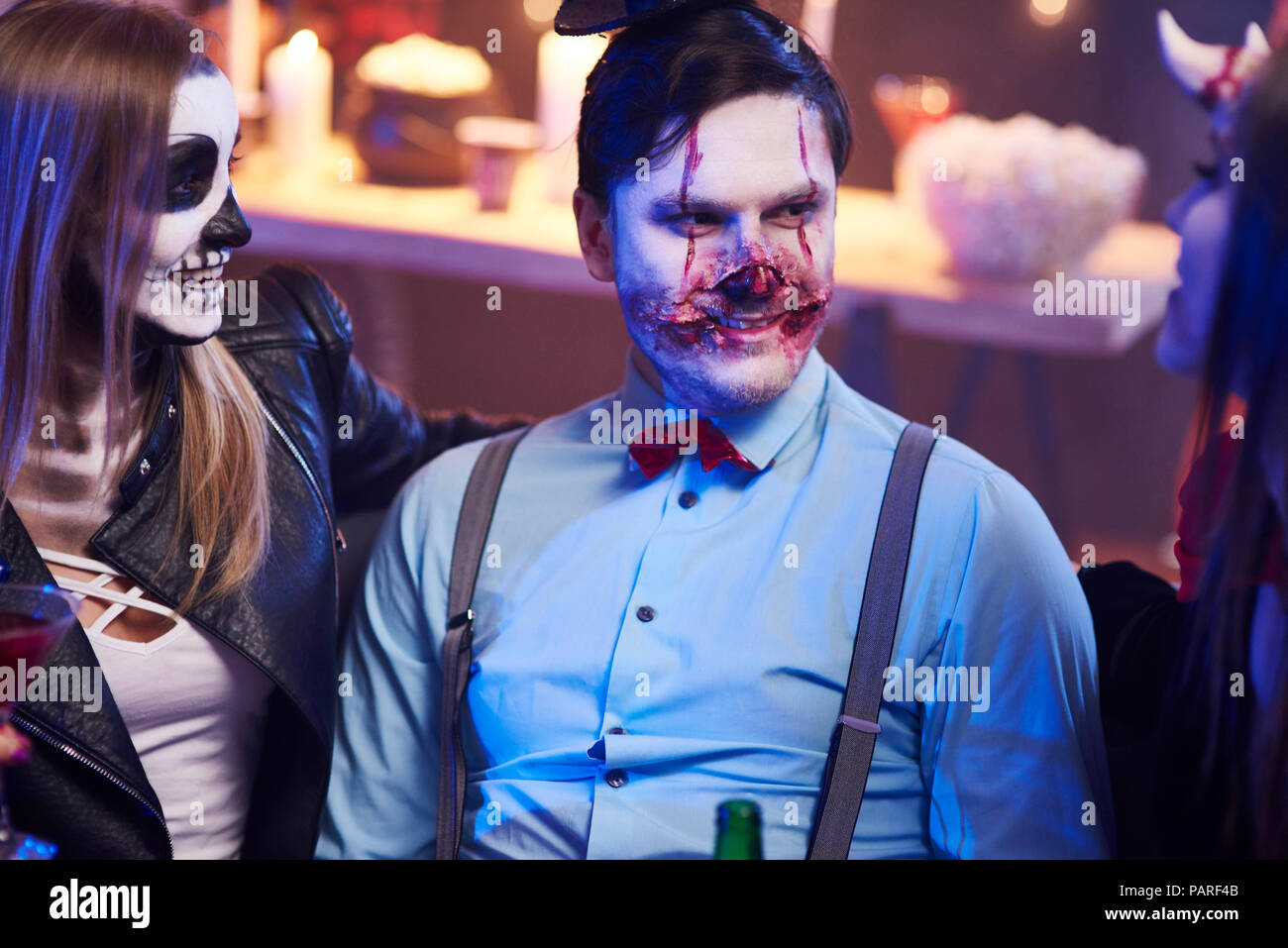 Best friends sitting at Halloween party Stock Photo