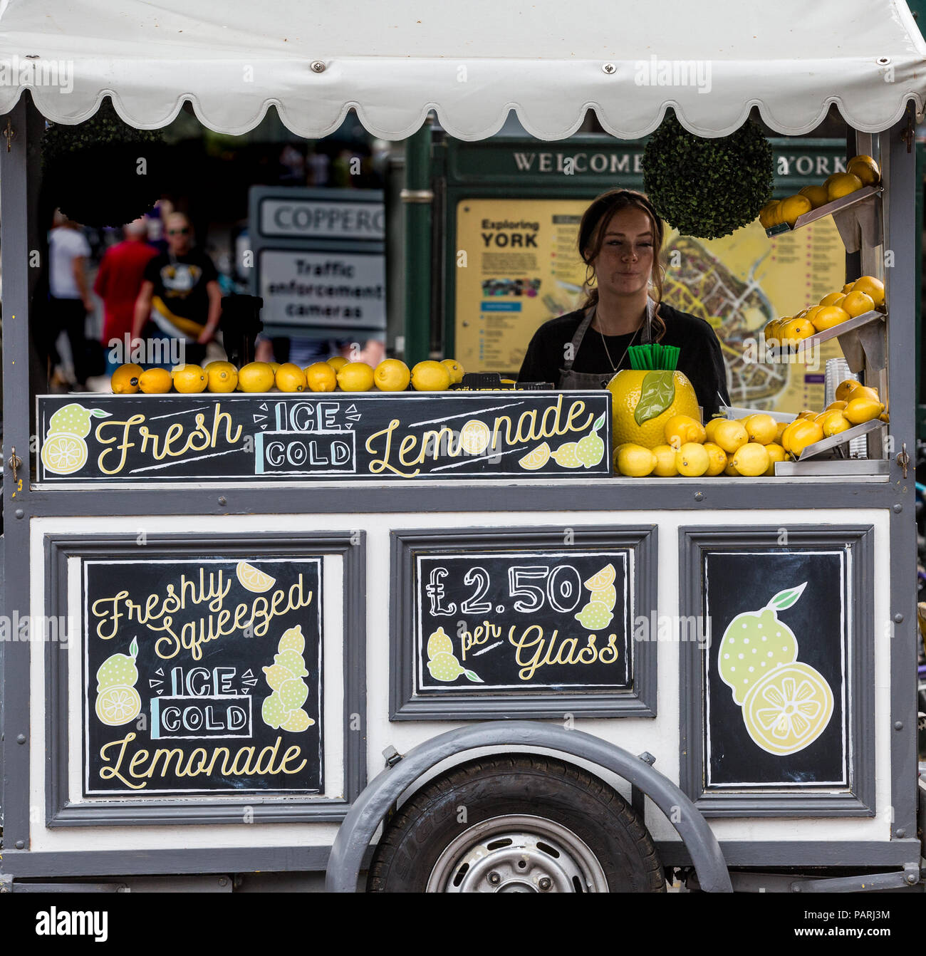 A lemonade stand selling freshly squeezed lemonade to customers during
