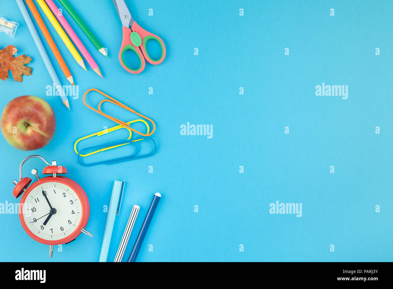 Creative flat lay top view back to school concept with alarm clock ...