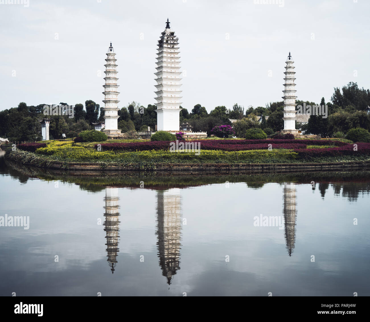 Three Dali style pagodas of Bai minorities in Yunnan nationalities village in Kunming, China Stock Photo