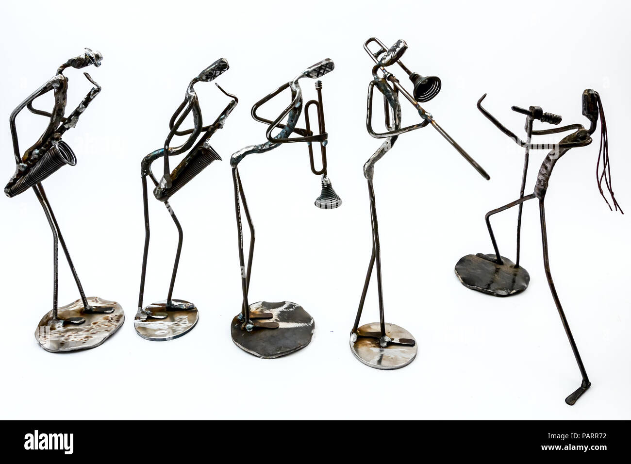 Band made of performers playing with saxophone; trumpet, trombone and