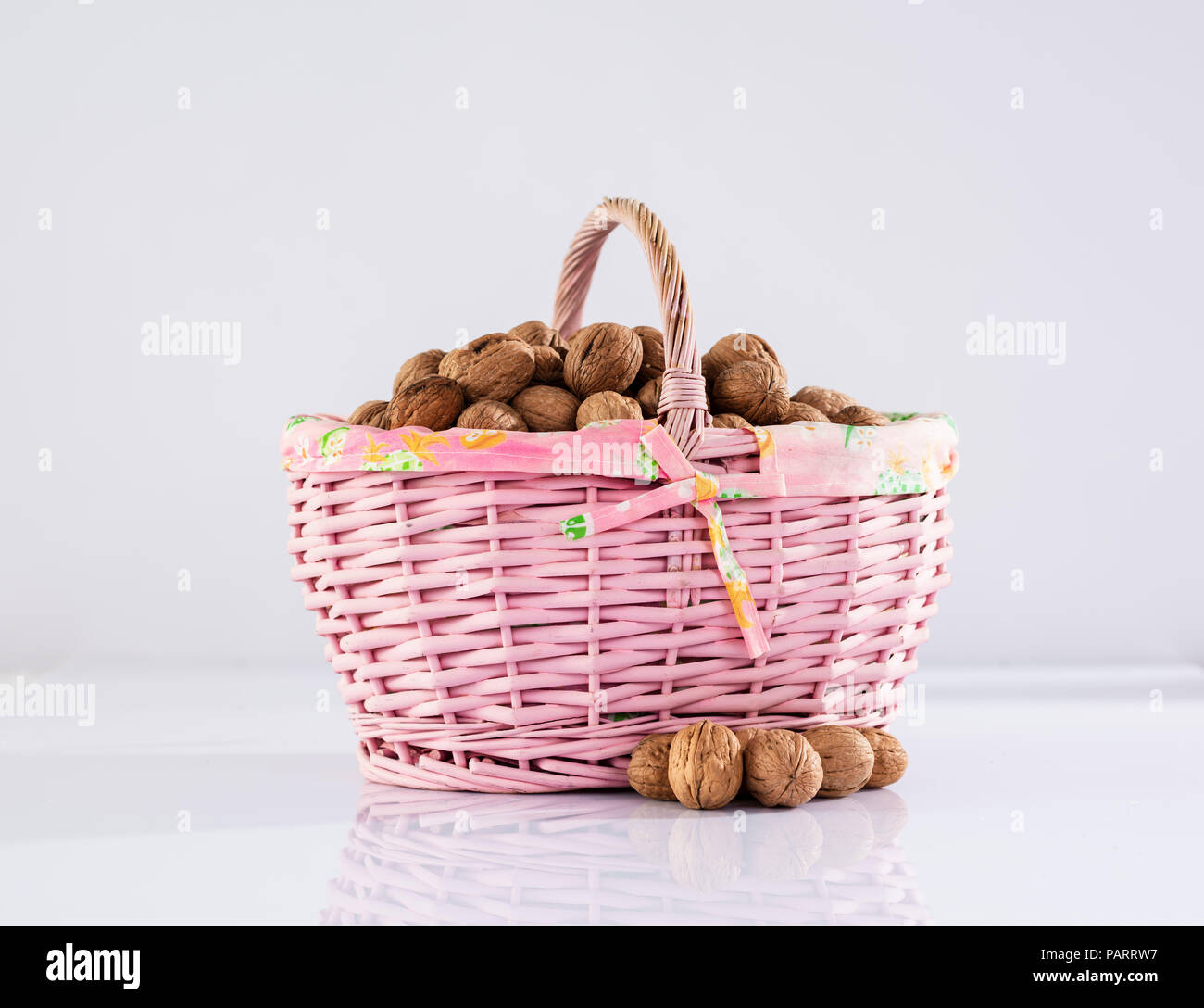 Nuts in basket Stock Photo