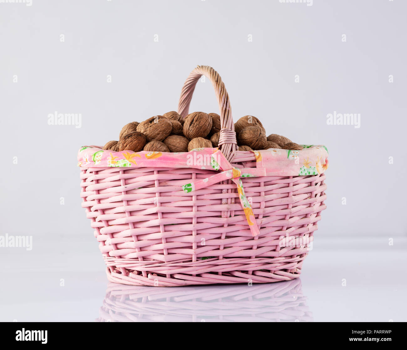 Nuts in basket Stock Photo