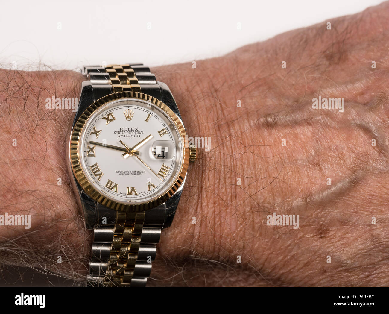 Rolex Oyster Datejust mens watch on old male wrist Stock Photo