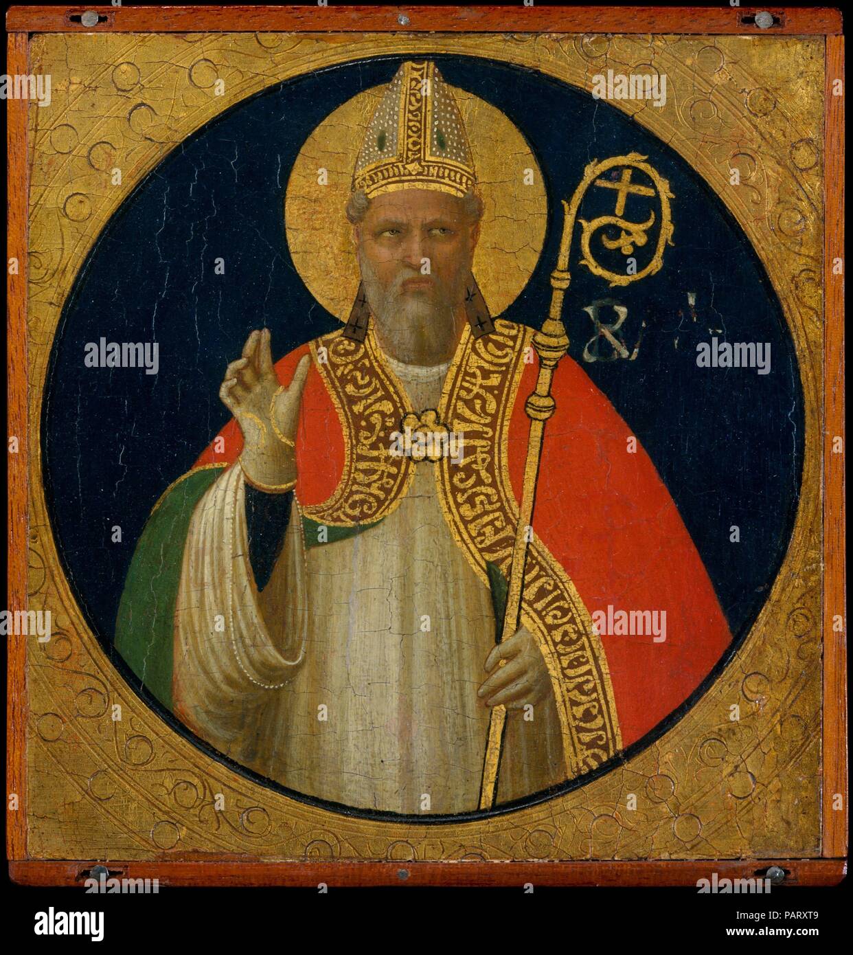 A Bishop Saint. Artist: Fra Angelico (Guido di Pietro) (Italian, Vicchio di Mugello ca. 1395-1455 Rome). Dimensions: Overall 6 1/4 x 6 1/8 in. (15.9 x 15.6 cm); diameter of roundel 5 7/8 in. (14.9 cm). Date: ca. 1425.  This early work by Fra Angelico dates about 1425 and formed part of the decoration of the frame of an altarpiece still in the church of San Domenico, Fiesole, where the artist was a friar until 1436. The altarpiece was modernized in 1501, and parts of its frame were sold in the nineteenth century. The elegant figure type and delicate modeling owe much to the example of Ghiberti, Stock Photo