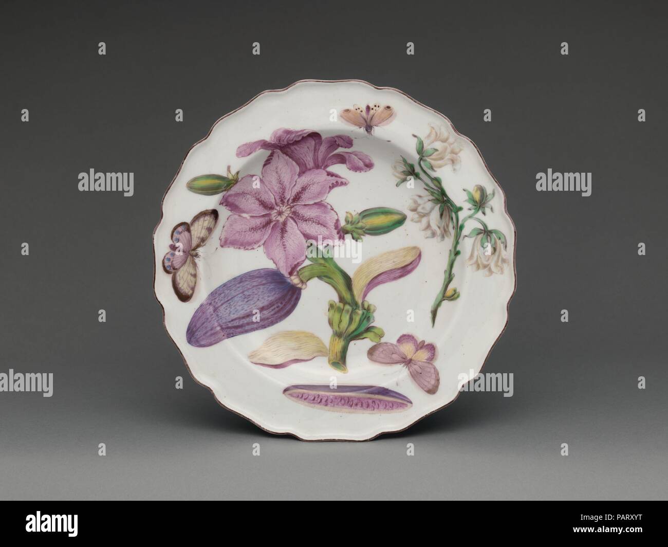 Botanical plate with a flowering eggplant. Culture: British, Chelsea. Dimensions: Overall (confirmed): 1 3/8 × 9 1/16 × 9 1/16 in., 1 lb. (3.5 × 23 × 23 cm, 0.5 kg). Maker: Chelsea Porcelain Manufactory (British, 1745-1784, Red Anchor Period, ca. 1753-58). Date: ca. 1755.  These botanical plates (2016.217-.226) were produced by the Chelsea factory around 1755 and are often referred to as Chelsea 'Hans Sloane' wares, in reference to the royal physician, traveler, and natural historian who helped transform the Chelsea Physik Garden into a center of botanical knowledge during the British Enlighte Stock Photo