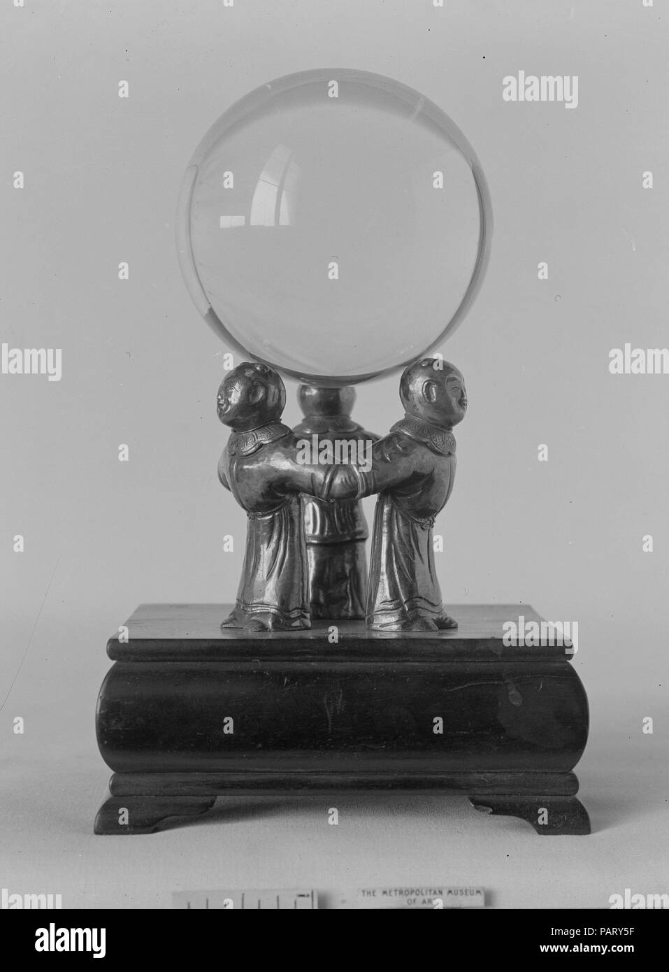 Crystal Ball on a Silver Stand composed of Three Figures. Culture: China. Dimensions: Diam. 2 9/16 in. (6.5 cm). Date: 18th century. Museum: Metropolitan Museum of Art, New York, USA. Stock Photo