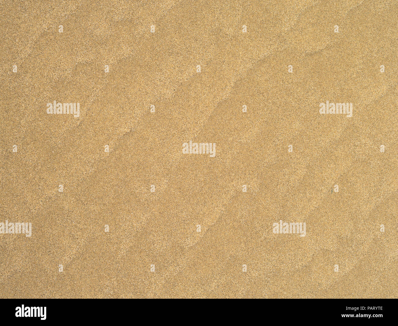 Wave patterns in the sand Stock Photo