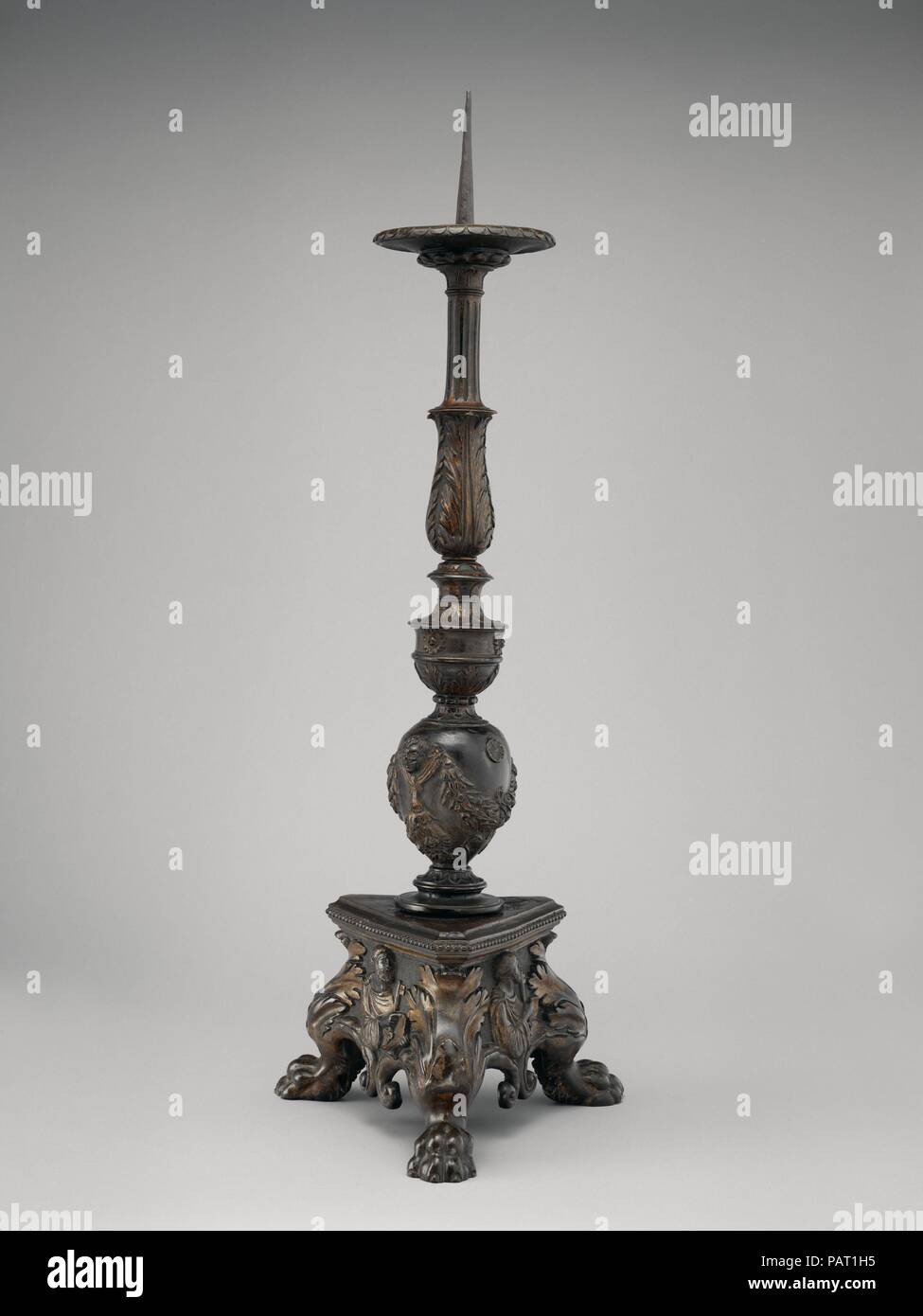 Pricket candlestick (one of a pair). Artist: Workshop of Vincenzo Grandi (mentioned 1507-1577/78); and Gian Gerolamo Grandi (1508-1560). Culture: Italian, Trent or Padua. Dimensions: Overall (confirmed): 36 1/2 × 12 1/2 × 13 in. (92.7 × 31.8 × 33 cm). Date: ca. 1545-50.  Analogies of texture and composition (figures from which a Byzantine stiffness has not altogether disappeared) between these and three flagpole stands by Alessandro Leopardi in Piazza S. Marco, Venice, permit an attribution of the candlesticks at least to Leopardi's sphere of influence. The candlesticks were part of a set of s Stock Photo