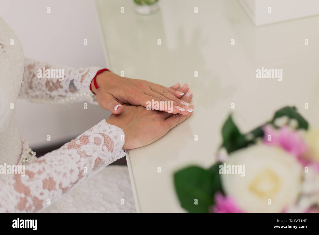 Wedding bouquet of flowers in brides' hands Stock Photo Alamy