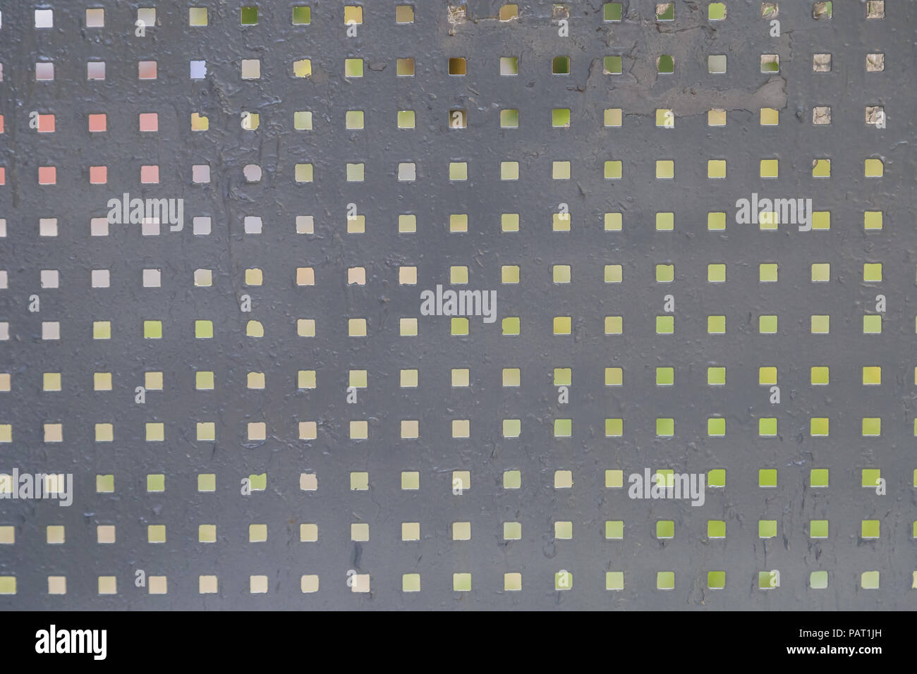 Iron background with square holes, metal texture. Stock Photo