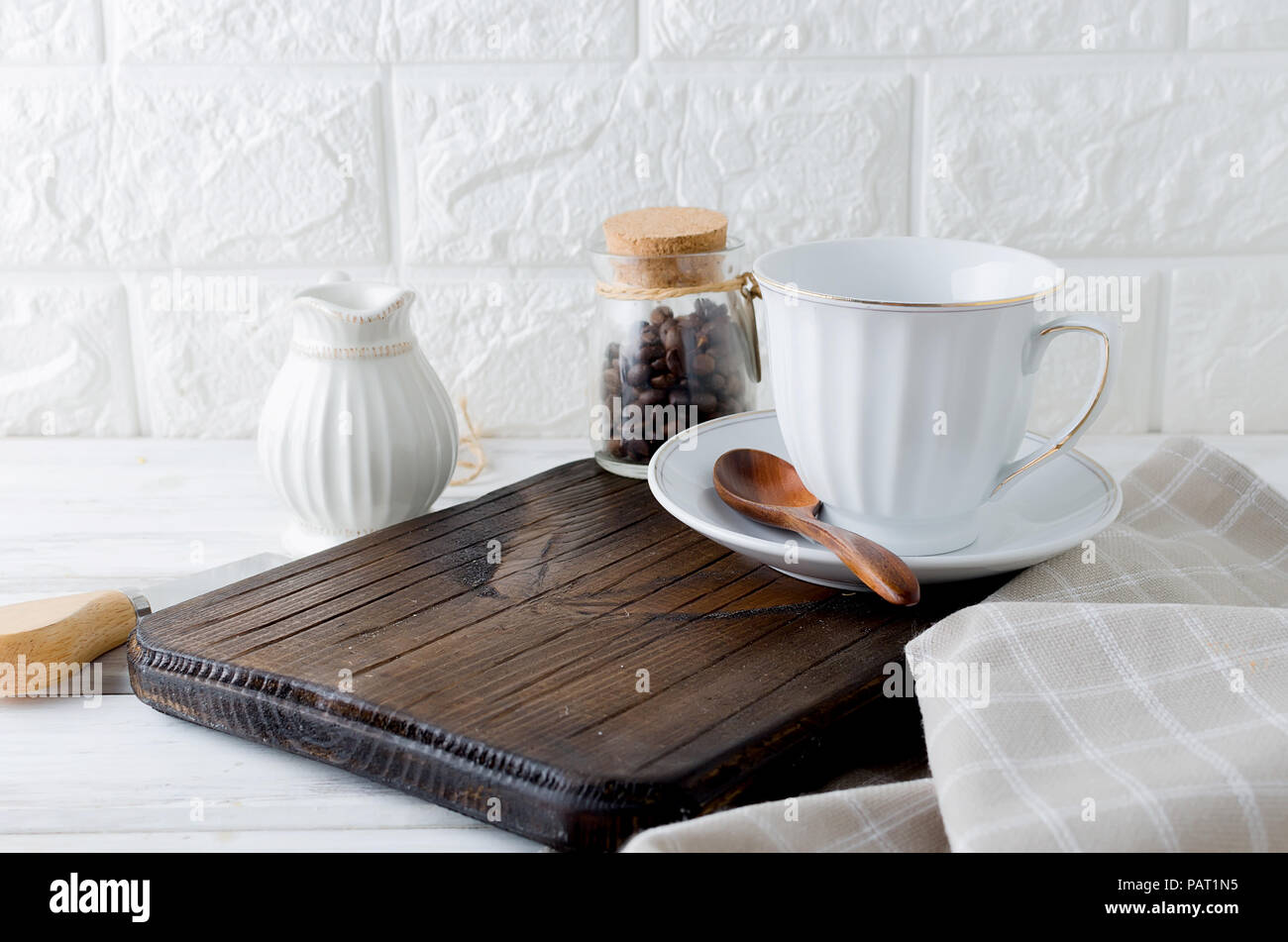 set of empty utensils for coffee, cup, milkman and a can of coffee