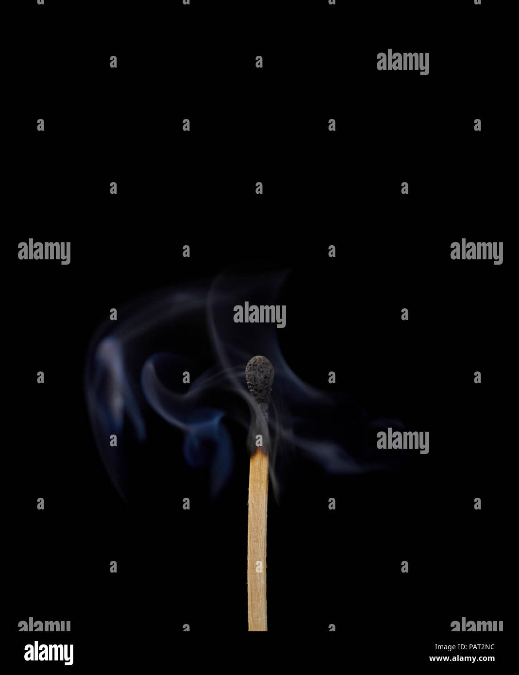 Match off on a black background with smoke Stock Photo