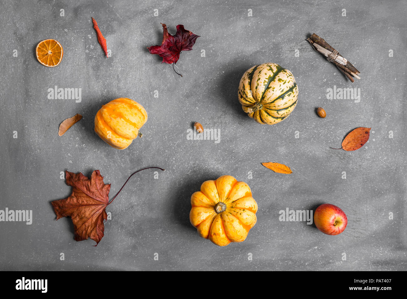 Autumnal flat lay arrangement of various objects scattered across scratchy background Stock Photo