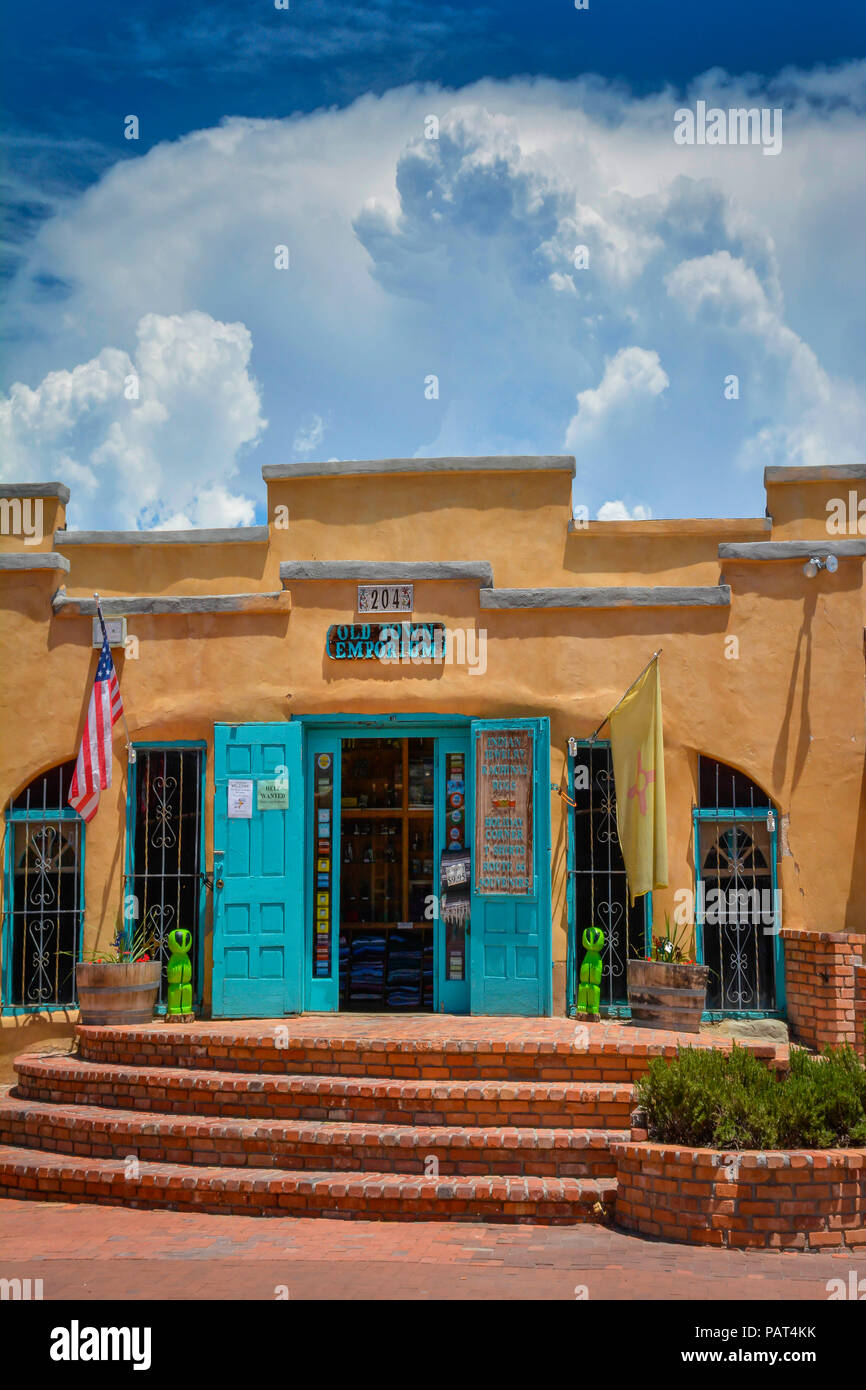 An adobe style complex with turquoise trim features shopping Emporiums