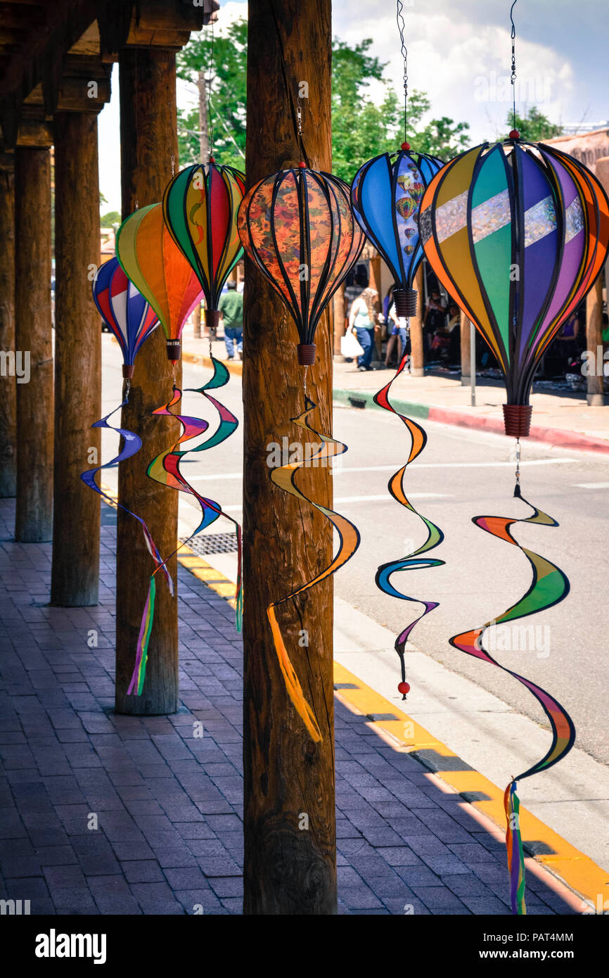 Handcrafted art of hot air balloons hang from under portico of Souvenir shop in of Old Town Albuquerque, NM Stock Photo
