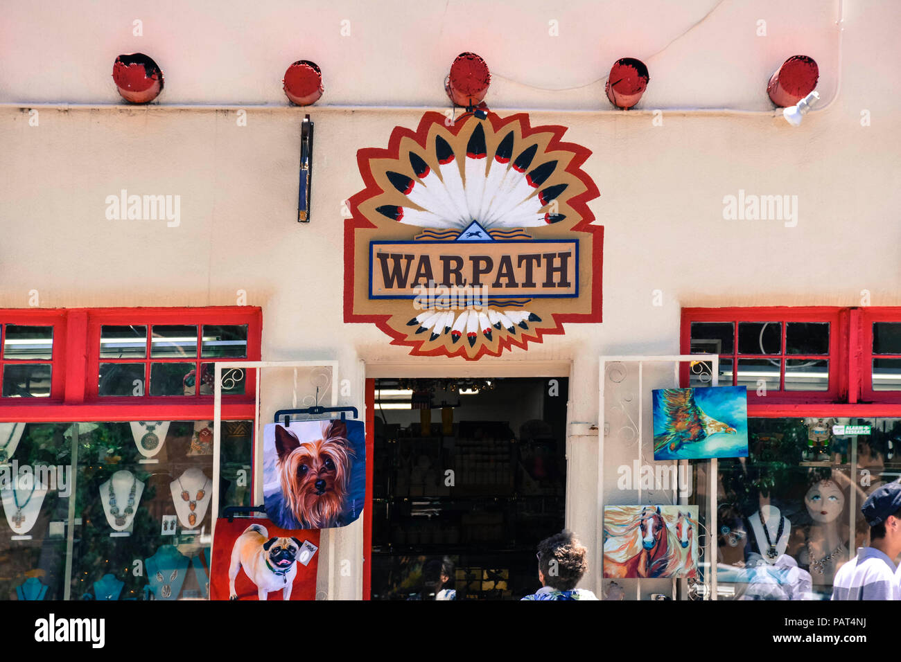 A colorful Entrance to old adobe building, the Warpath, an Native American gift shop  welcoming tourists in old Town Albuquerque, NM, USA Stock Photo