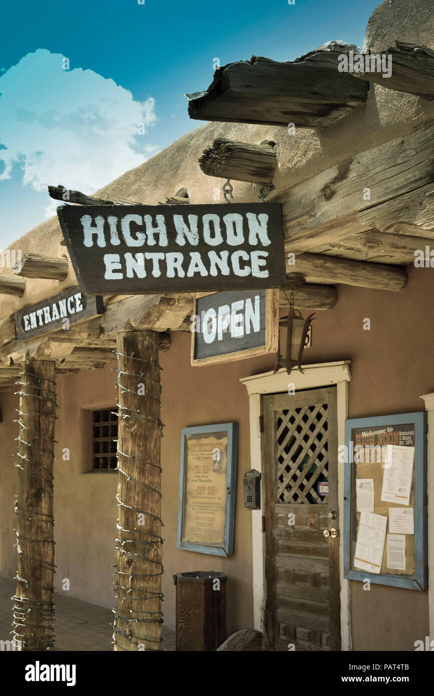 A handmade sign hangs at entrance to the old adobe building housing the High Noon restaurant and saloon  in Old town Albuquerque, NM Stock Photo