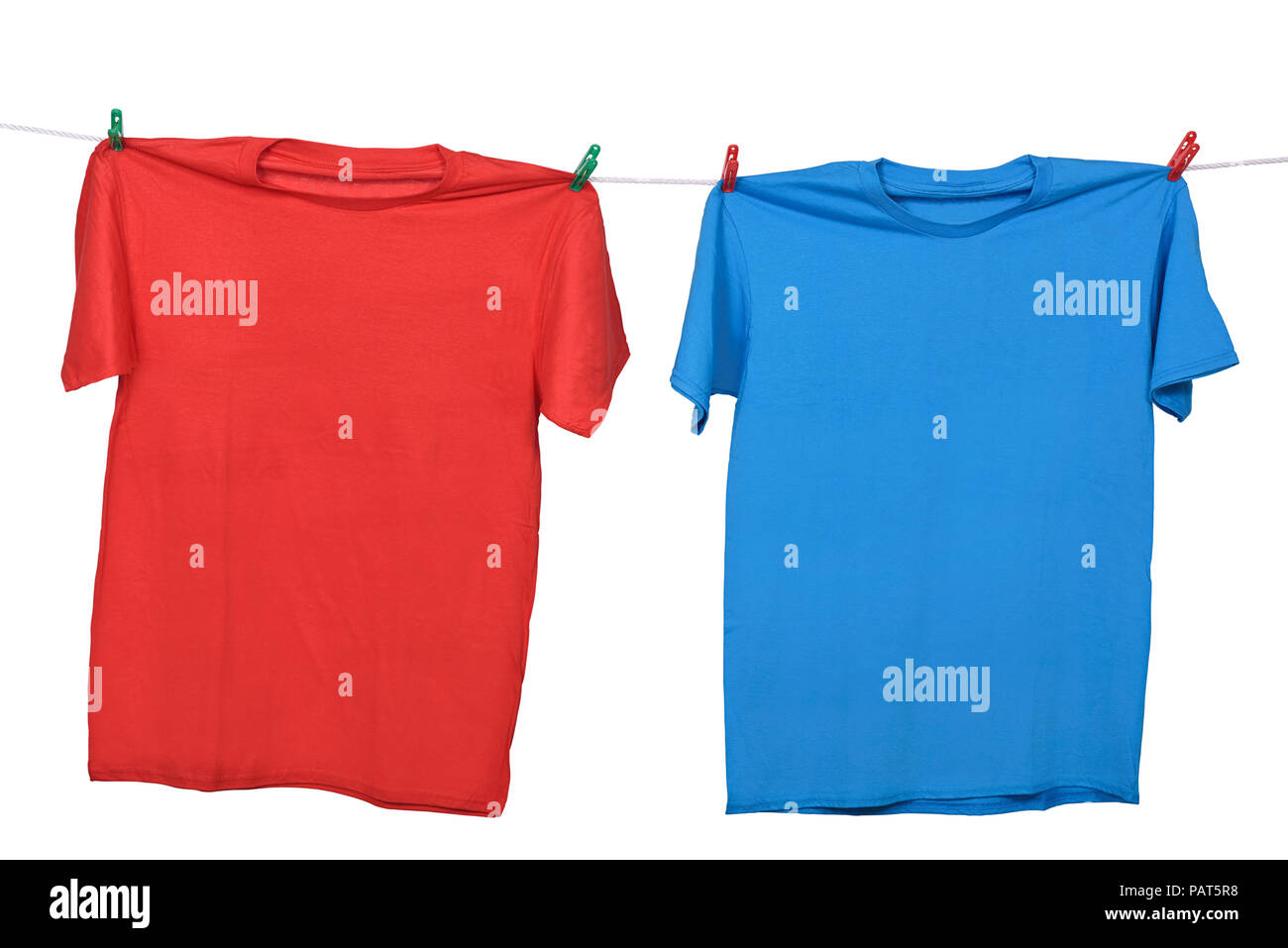 Red and blue clothes hanging on the clothesline isolated over white background Stock Photo Alamy