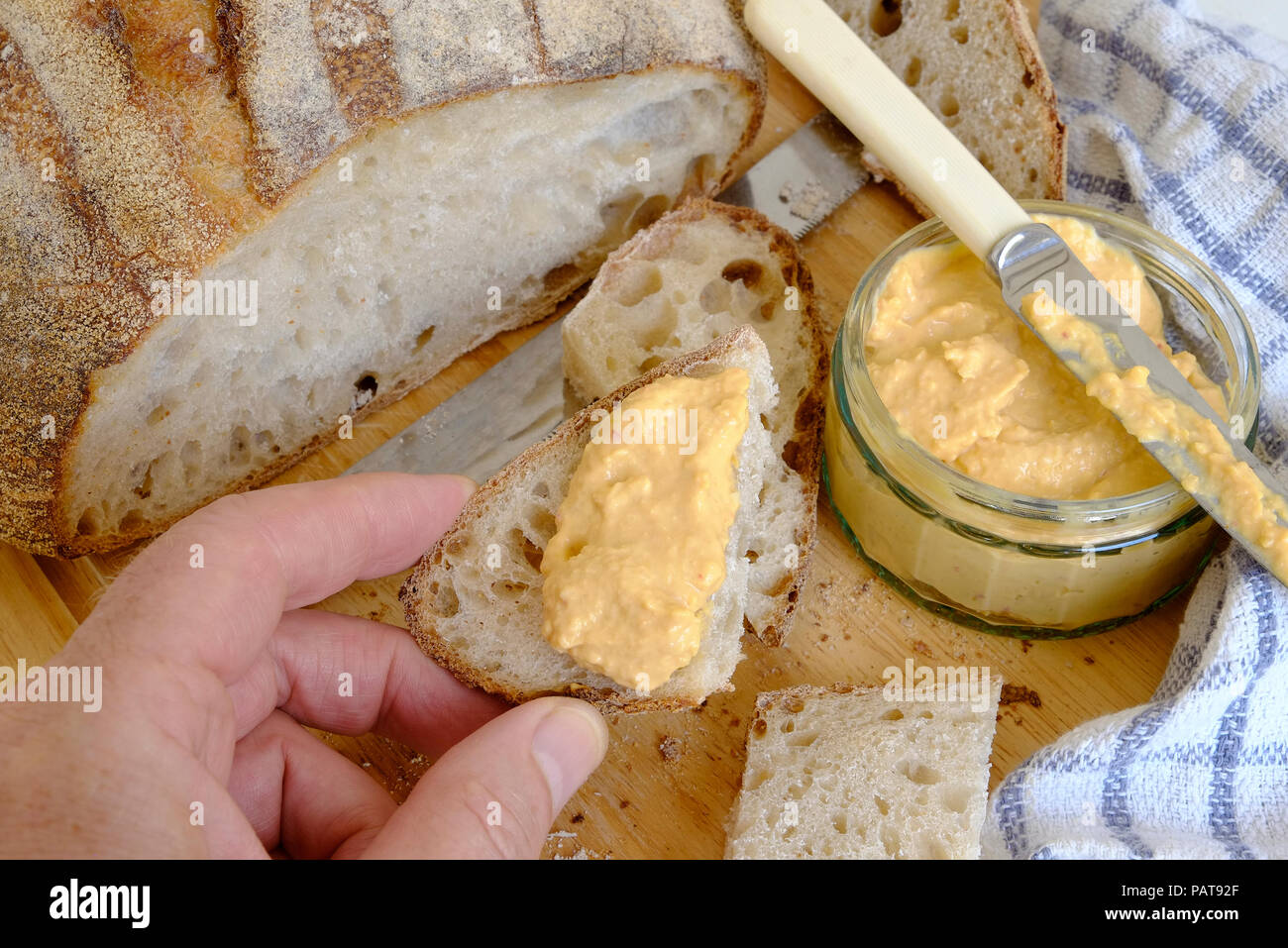 rustic sourdough bread and sweet chilli houmous Stock Photo