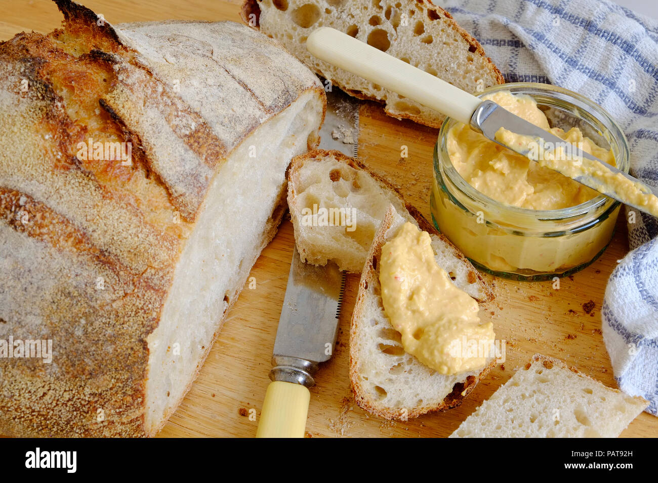 rustic sourdough bread and sweet chilli houmous Stock Photo