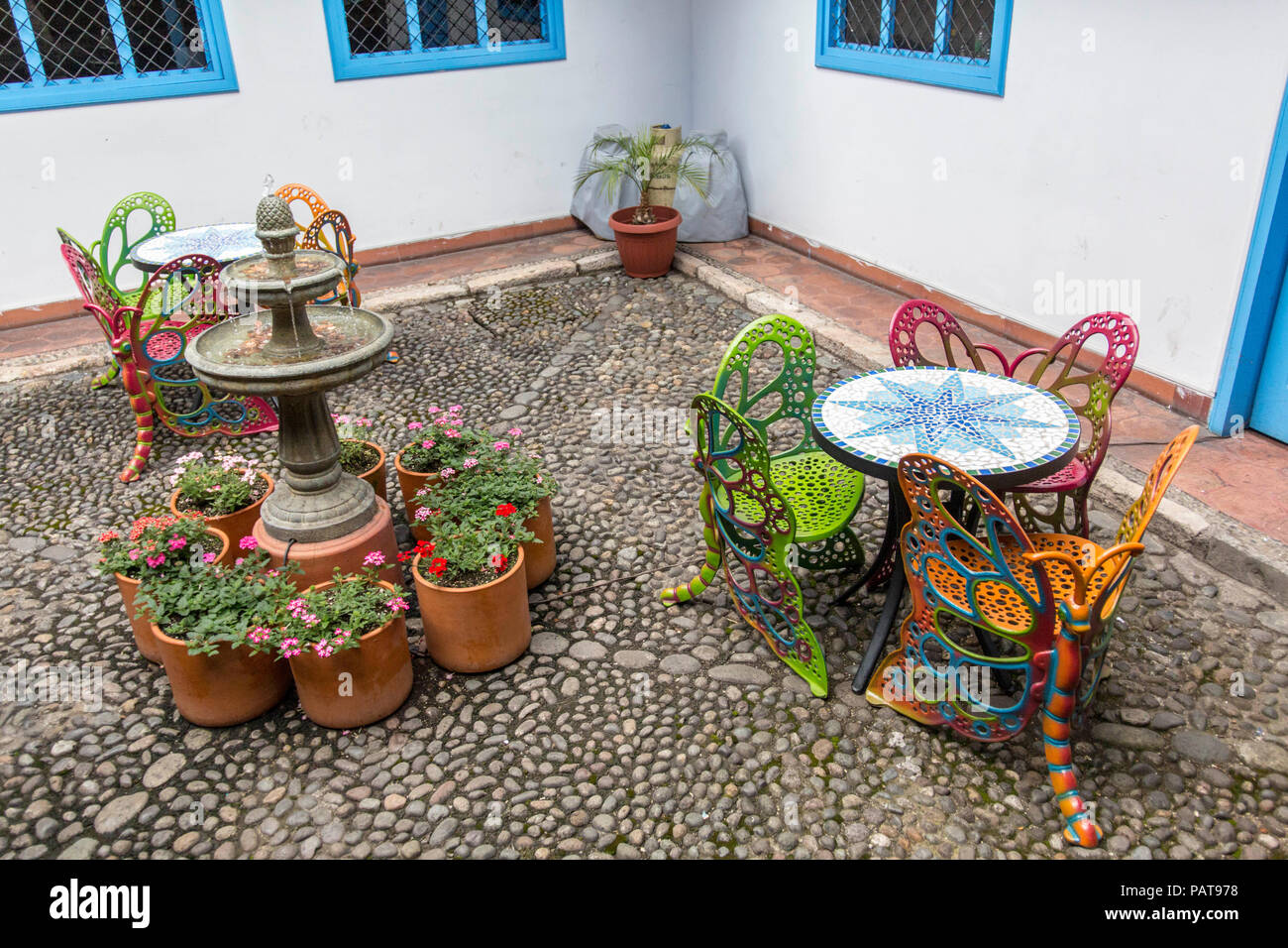 Patio furniture in a courtyard in Cuenca Ecuador Stock Photo Alamy